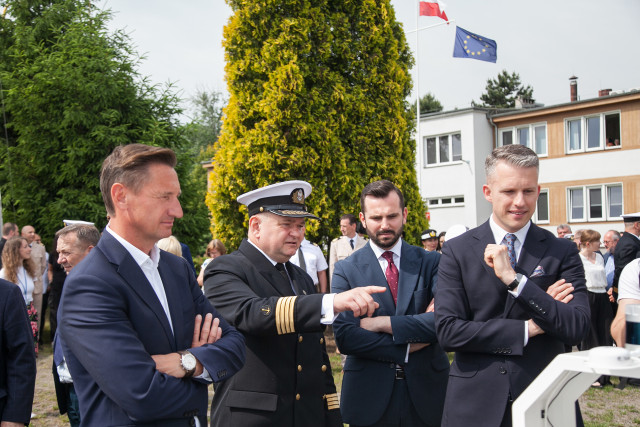 Marshall of the West Pomeranian Region Olgierd Geblewicz, MUS Rector Wojciech Ślączka, Deputy Governor of the West Pomeranian Region, Bartosz Brożyński, Secretary of State at the Ministry of Infrastructure Arkadiusz Marchewka by the large-scale ship model